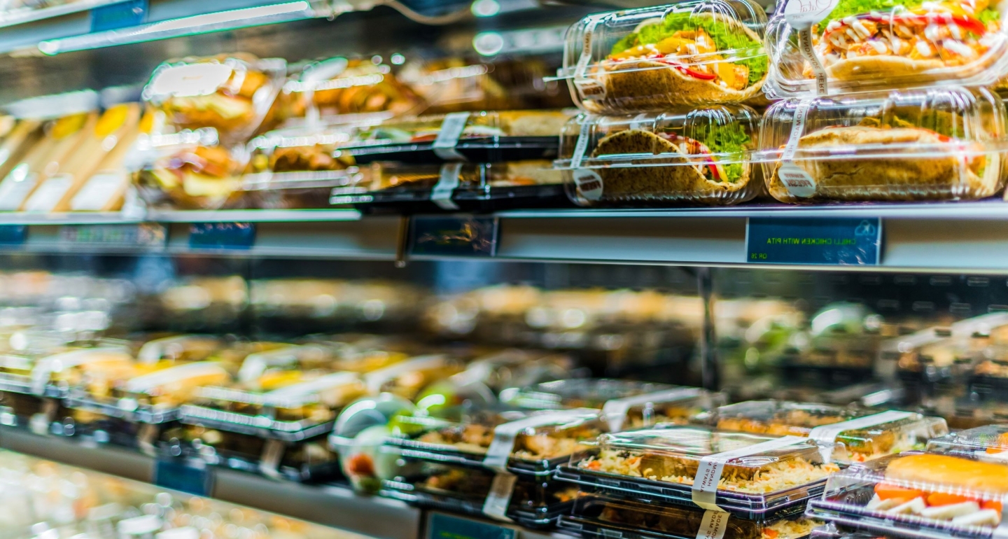 Pre-packaged foods displayed in a commercial refrigerator