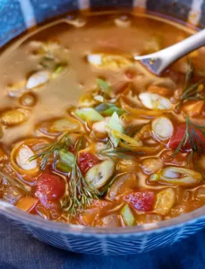 a bowl of greek lentil soup