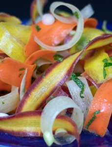 shaved carrots topped with herbs