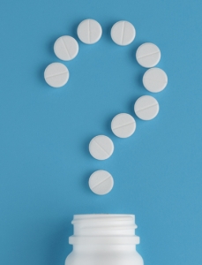 pills in a question mark shape