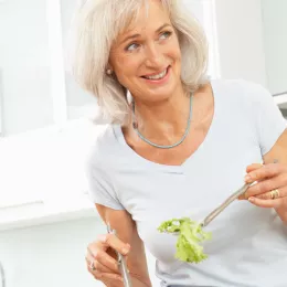 a woman making a salad