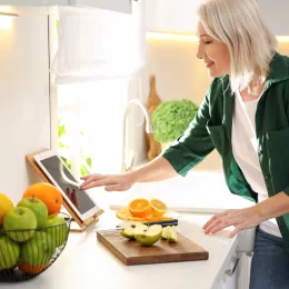 a woman cutting fruit