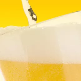 beer pouring into a glass