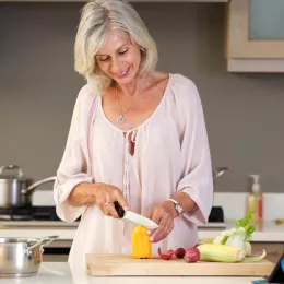 woman cutting vegetables