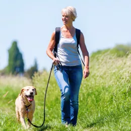 a woman walking her dog