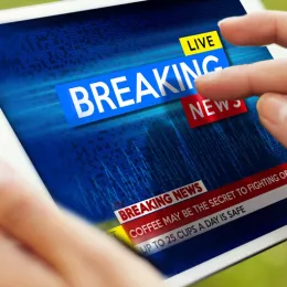 tablet with "breaking news" on it