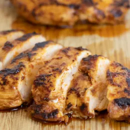 grilled chicken on cutting board