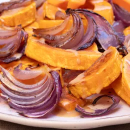 plate of  chopped onions and sweet potatoes 