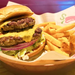 Chilis Double OldTimer with cheese on plate with fries