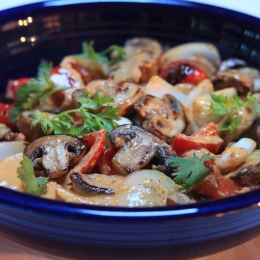blue bowl with mushrooms and other veggies mixed 