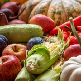 Seasonal produce - a variety of September produce, including apples, peppers, pumpkins, corn, and zucchini