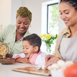 a happy family having cereal for breakfast