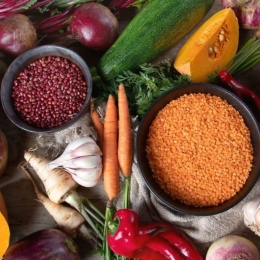 An assortment of fall produce, healthy grains, and dry legumes and lentils