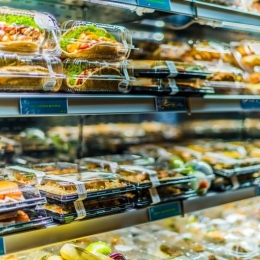 Pre-packaged foods displayed in a commercial refrigerator