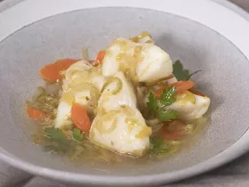 white fish poached with leeks, carrots, and celery