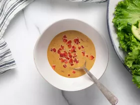 a bowl of peanut dressing