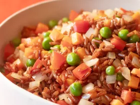 fried brown rice with carrots and peas