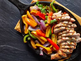 fajita chicken and peppers in a skillet