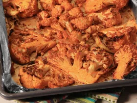 metal pan with sliced and roasted cauliflower