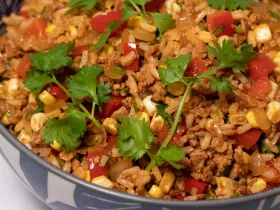 dish of fried rice, garnished with cilantro