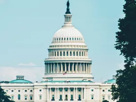 U.S. Capitol Building with a hazy blue sky in the background