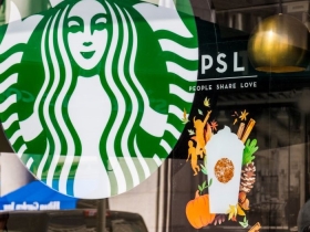 A Starbucks storefront advertising the annual Pumpkin Spice Latte