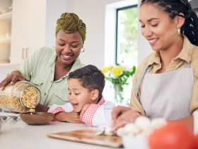 a happy family having cereal for breakfast