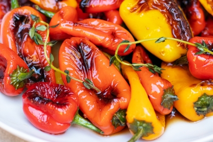 bowl of grilled red, yellow and orange mini bell pepers