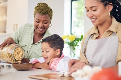 a happy family having cereal for breakfast