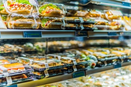 Pre-packaged foods displayed in a commercial refrigerator