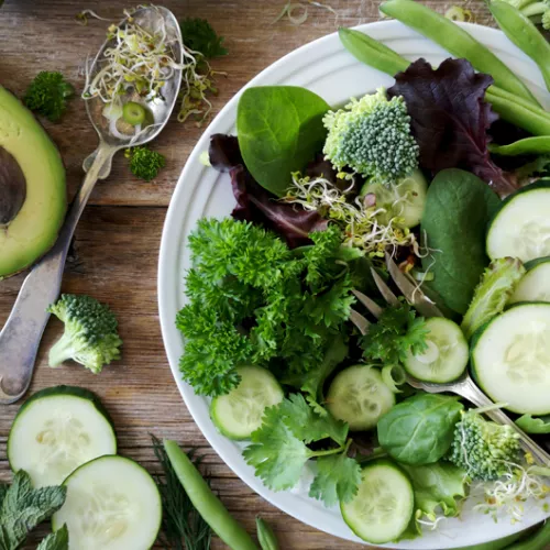 a salad full of green vegetables