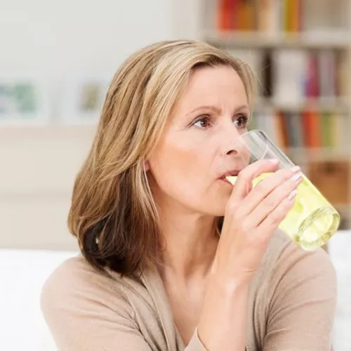 woman drinking beverage