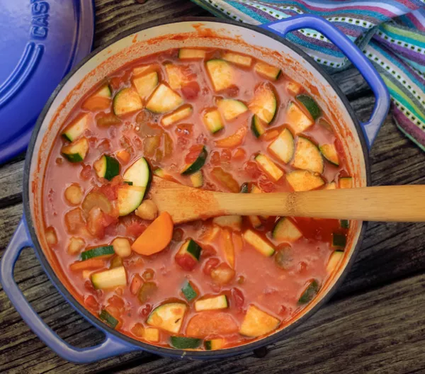 over head shot of large pot filled with minsestrone stew