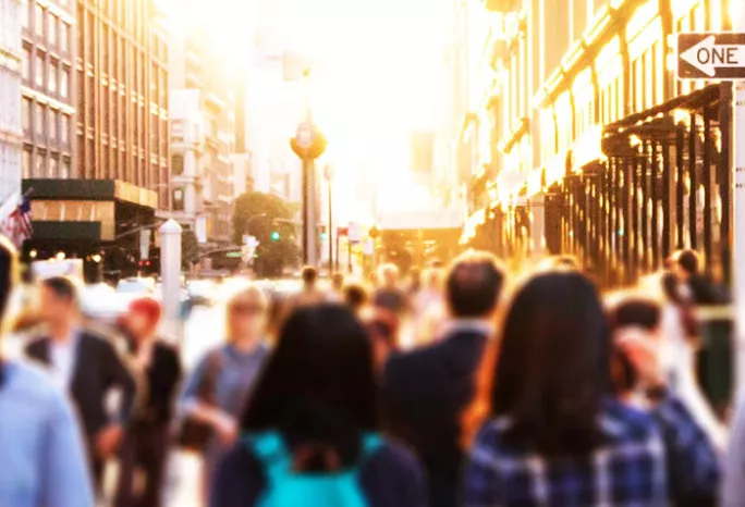 people walking on a city street