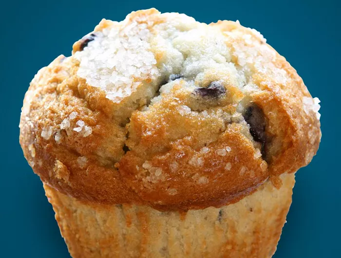 blueberry muffin with a blue background