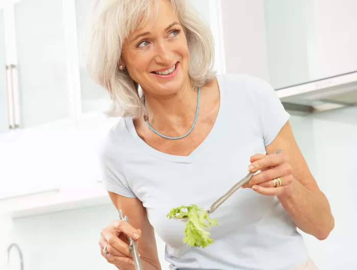 a woman making a salad