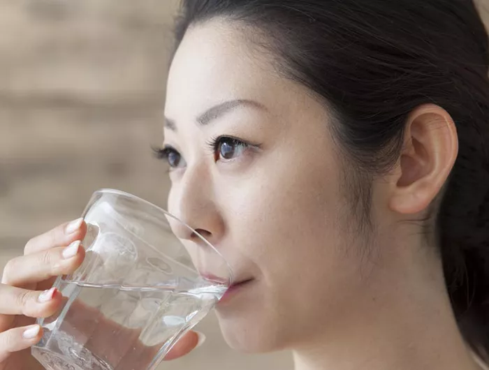 a woman drinking water