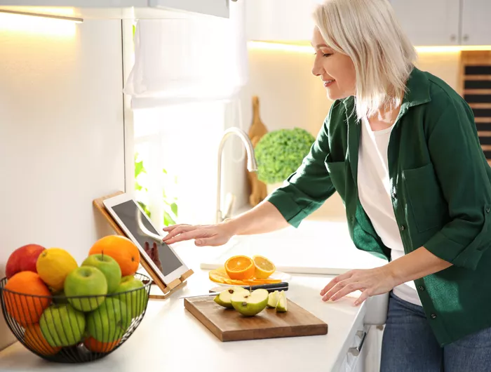 a woman cutting fruit