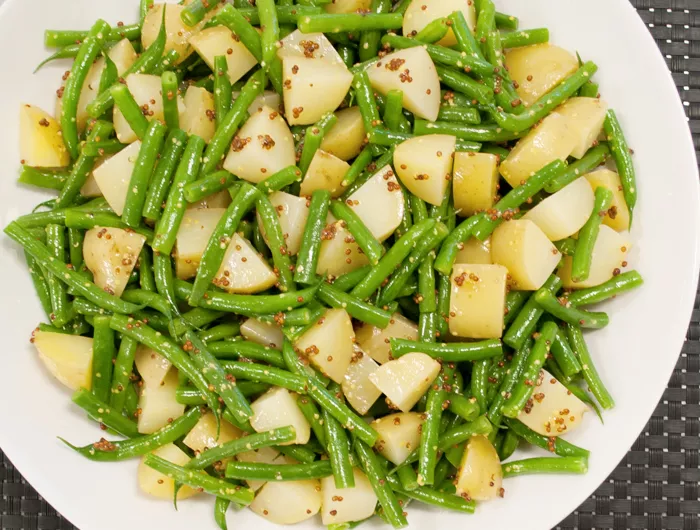 a plate of green bean potato salad