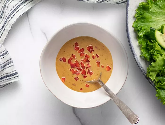 a bowl of peanut dressing