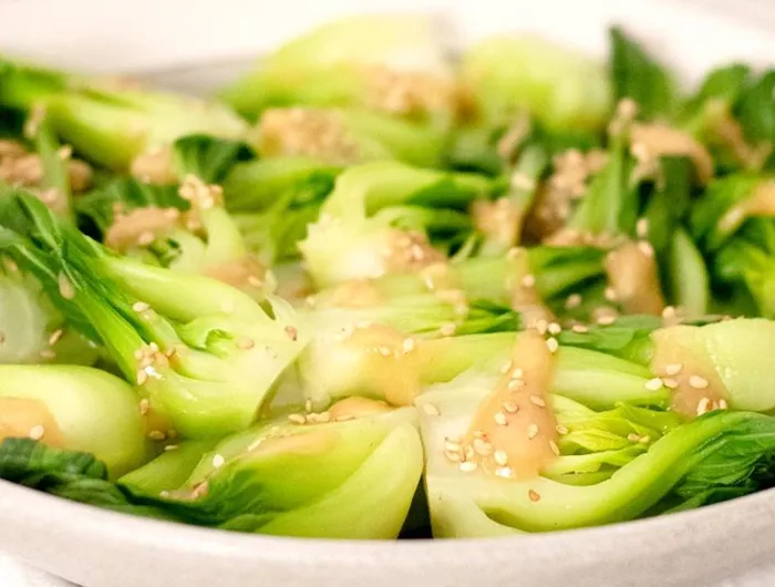 steamed bok choy with sesame sauce drizzled on top