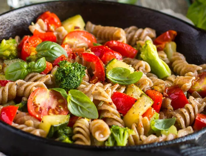 a skillet of pasta and vegetables