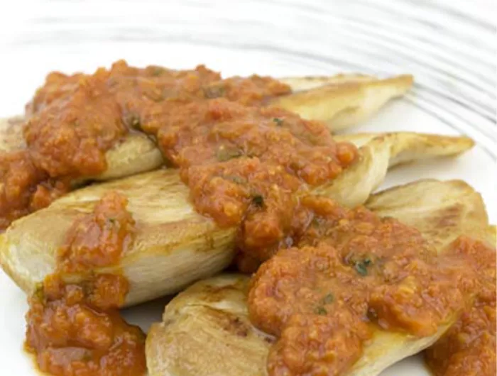 chicken cutlets with tomato sauce over the top