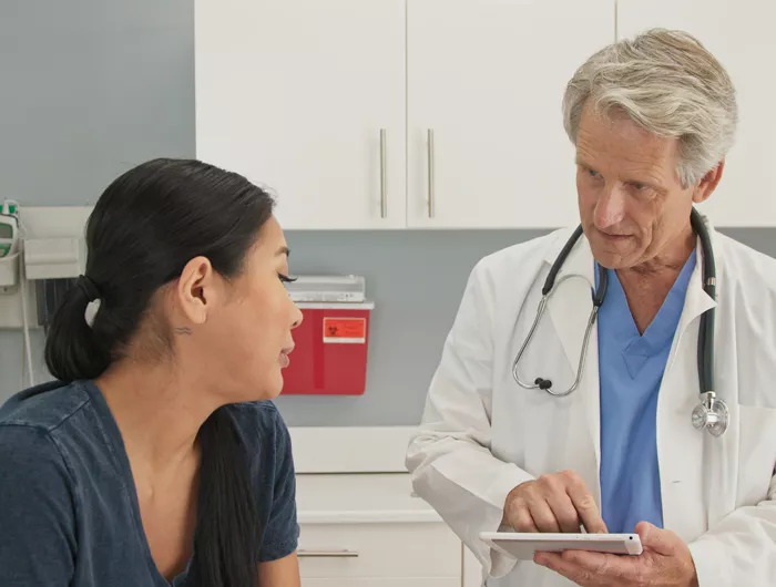 a woman talking to her doctor