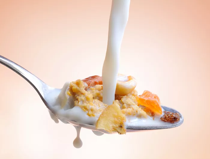 cereal and milk on a spoon