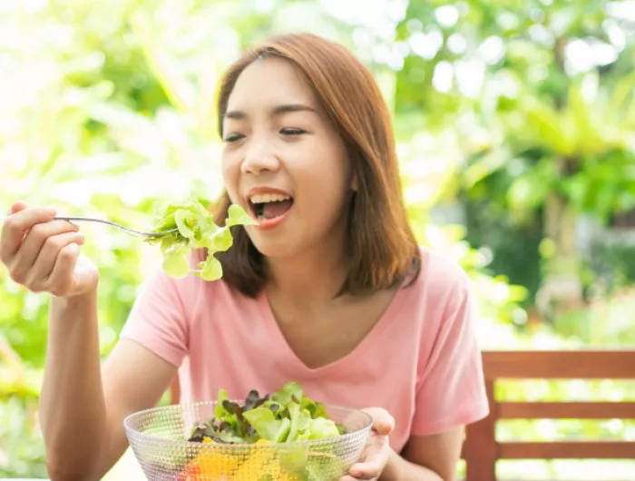 woman eating salad