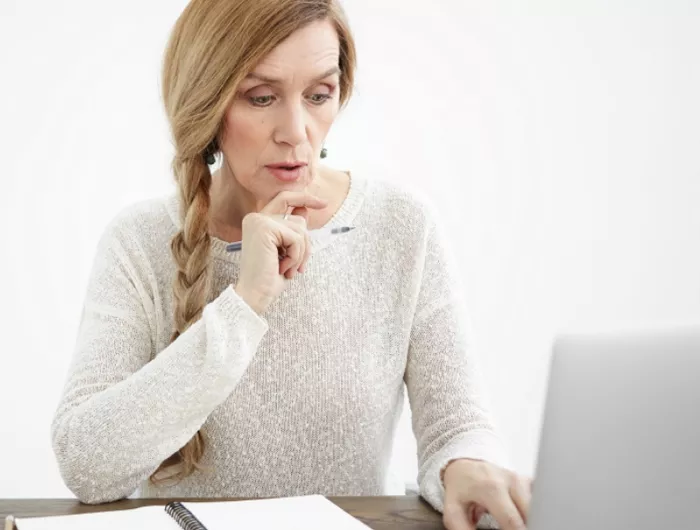 woman looking at computer screen