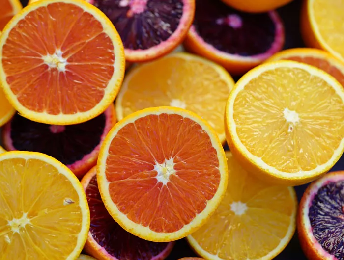 several slices of different colored oranges