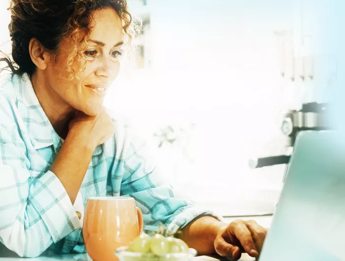 woman looking at laptop screen