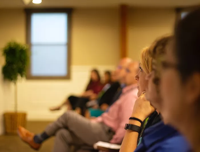 People participating in a listening session